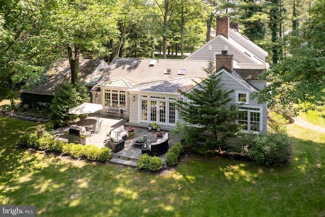 200 Hun Rd, Princeton, NJ 08540 - rear view of house with french doors, a standing seam roof, a patio, and a yard