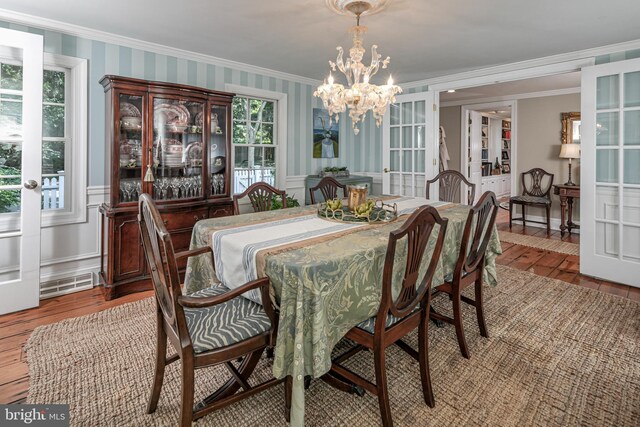 200 Hun Rd, Princeton, NJ 08540 - dining area featuring crown molding, french doors, wood-type flooring, a chandelier, and wainscoting