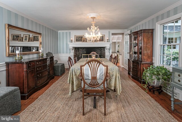 200 Hun Rd, Princeton, NJ 08540 - dining area with wallpapered walls, crown molding, wood finished floors, a chandelier, and a wainscoted wall