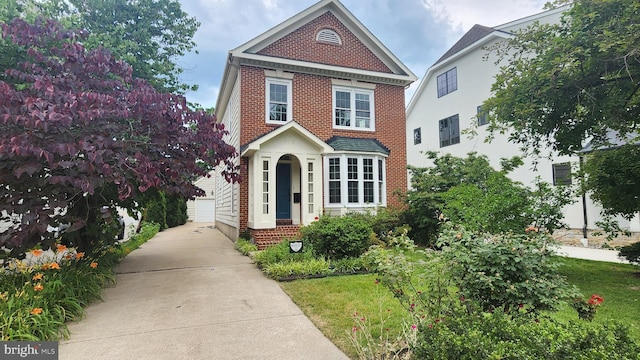 1412 N Hancock St, Arlington, VA 22201 - view of front facade with brick siding and a garage