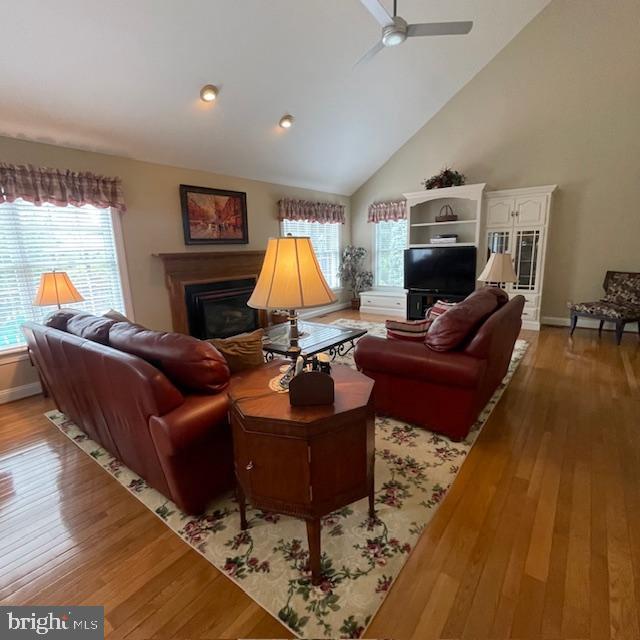 1359 Michael Way, Lansdale, PA 19446 - living area featuring hardwood / wood-style flooring, a fireplace, a ceiling fan, and high vaulted ceiling