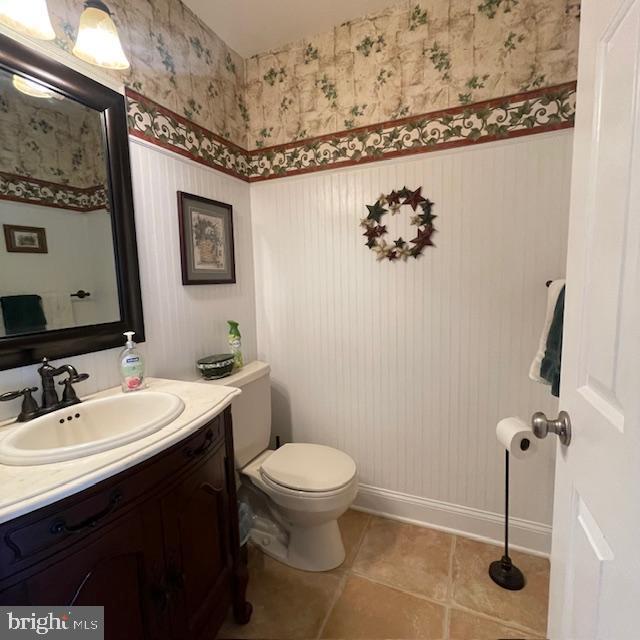 1359 Michael Way, Lansdale, PA 19446 - half bath with wallpapered walls, vanity, a wainscoted wall, baseboards, and toilet