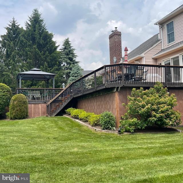 1359 Michael Way, Lansdale, PA 19446 - view of green lawn with a gazebo, a wooden deck, and stairs
