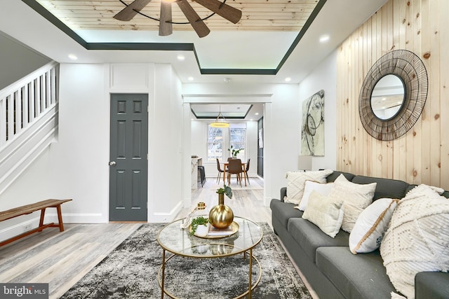 837 W 33rd St, Baltimore, MD 21211 - living area featuring wood finished floors, wooden walls, ceiling fan, stairway, and wood ceiling