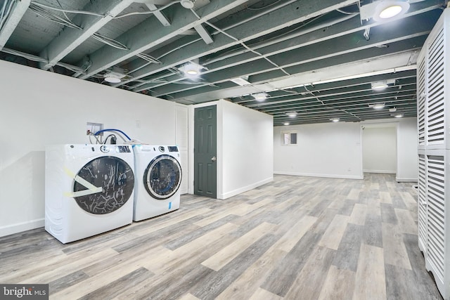 837 W 33rd St, Baltimore, MD 21211 - washroom with washer hookup, wood finished floors, and baseboards