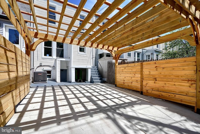 837 W 33rd St, Baltimore, MD 21211 - view of patio featuring central AC and a pergola
