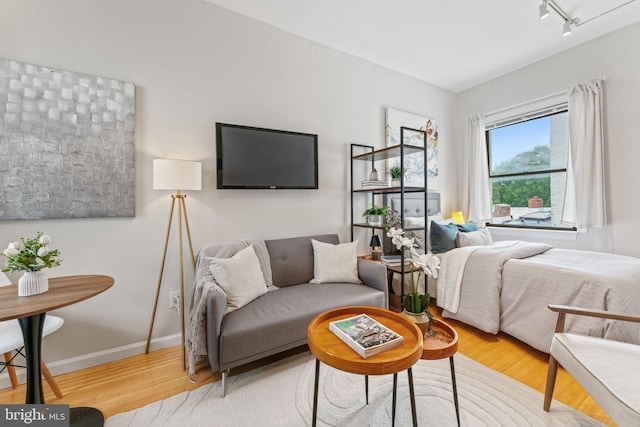 1822 15th St NW Unit 305, Washington, DC 20009 - bedroom featuring wood finished floors and track lighting
