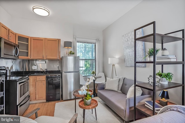 1822 15th St NW Unit 305, Washington, DC 20009 - living room with light wood-style flooring