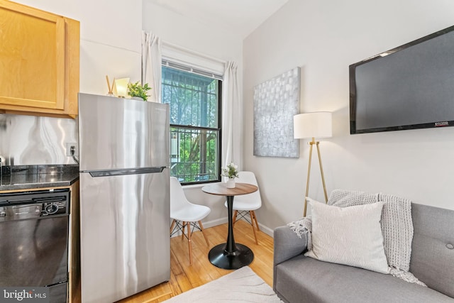 1822 15th St NW Unit 305, Washington, DC 20009 - kitchen featuring freestanding refrigerator, black dishwasher, and light wood-style flooring
