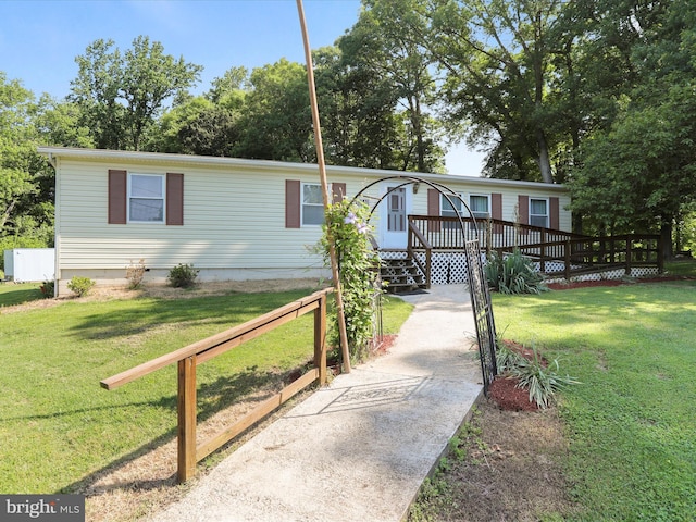 18540 Brooke Rd, Sandy Spring, MD 20860 - manufactured / mobile home with a front yard, a wooden deck, and crawl space