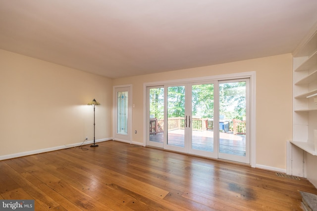 1901 Acorn Ln, Abington, PA 19001 - unfurnished living room with hardwood / wood-style floors, baseboards, and built in features