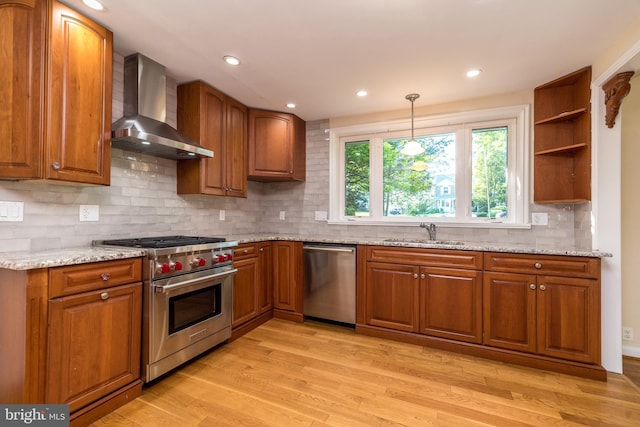 1901 Acorn Ln, Abington, PA 19001 - kitchen with appliances with stainless steel finishes, wall chimney exhaust hood, a sink, brown cabinetry, and recessed lighting