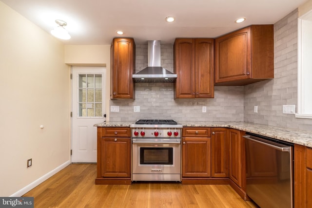 1901 Acorn Ln, Abington, PA 19001 - kitchen featuring wall chimney exhaust hood, stainless steel appliances, tasteful backsplash, brown cabinets, and recessed lighting