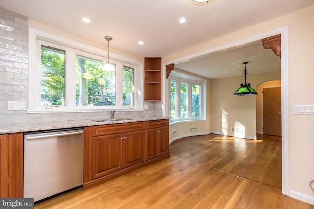 1901 Acorn Ln, Abington, PA 19001 - kitchen with dishwasher, a sink, brown cabinets, backsplash, and light stone countertops