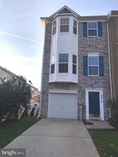 3313 Castle Ridge Cir, Silver Spring, MD 20904 - multi unit property with stone siding, concrete driveway, and an attached garage