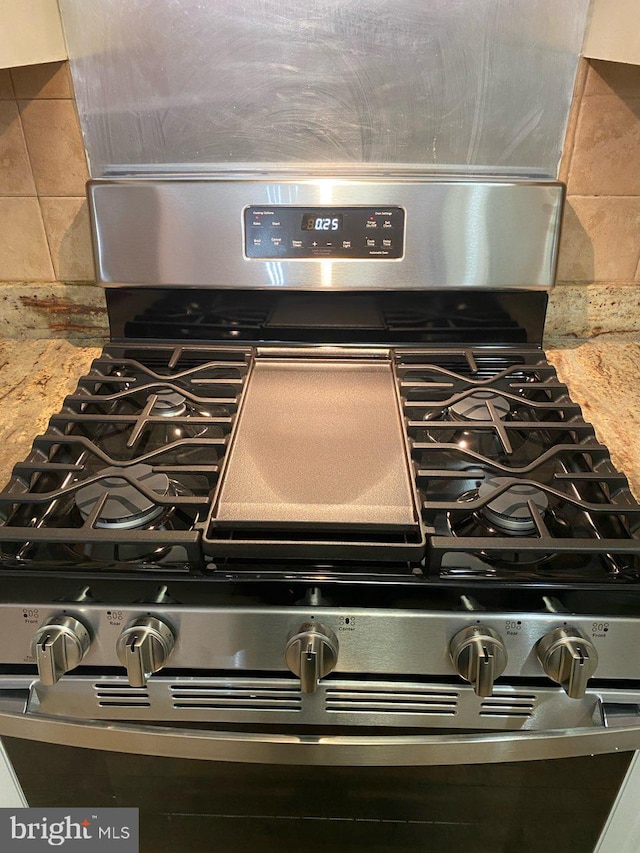 3313 Castle Ridge Cir, Silver Spring, MD 20904 - kitchen view of stainless steel range with gas cooktop and light stone countertops