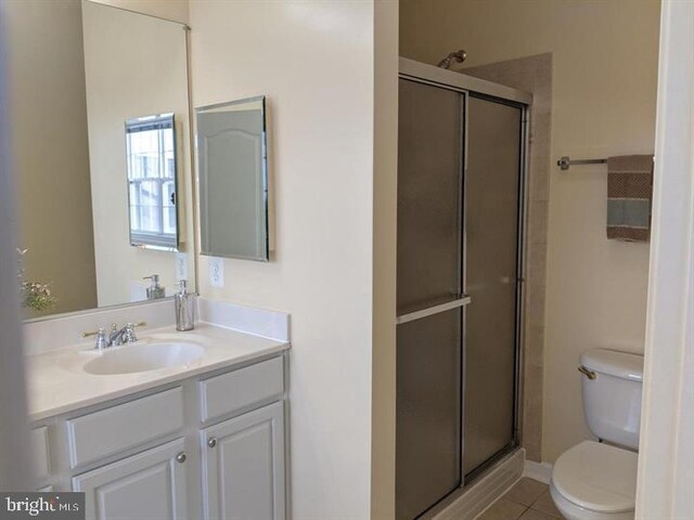 3313 Castle Ridge Cir, Silver Spring, MD 20904 - bathroom featuring toilet, vanity, a stall shower, and tile patterned flooring