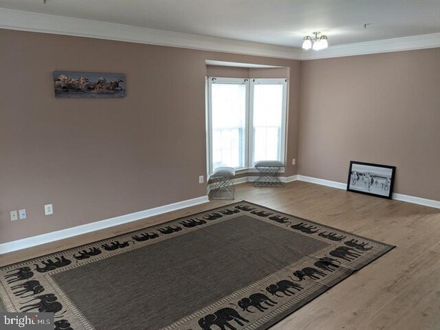 3313 Castle Ridge Cir, Silver Spring, MD 20904 - empty room featuring baseboards, wood finished floors, and crown molding