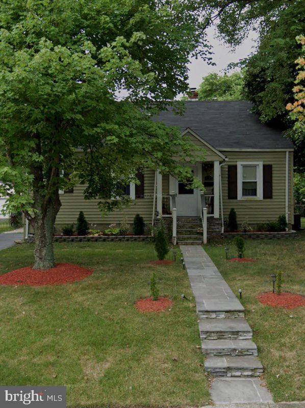 6709 Larches Ct, Suitland, MD 20746 - bungalow with a front lawn and a chimney