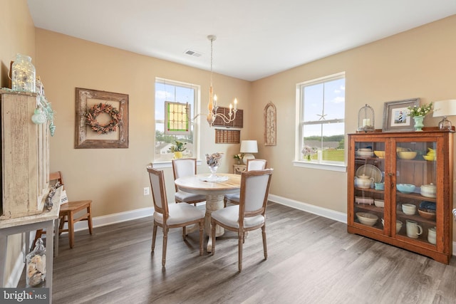 401 Bold Ruler Ct Unit 302, Havre De Grace, MD 21078 - dining space featuring wood finished floors, a chandelier, and healthy amount of natural light