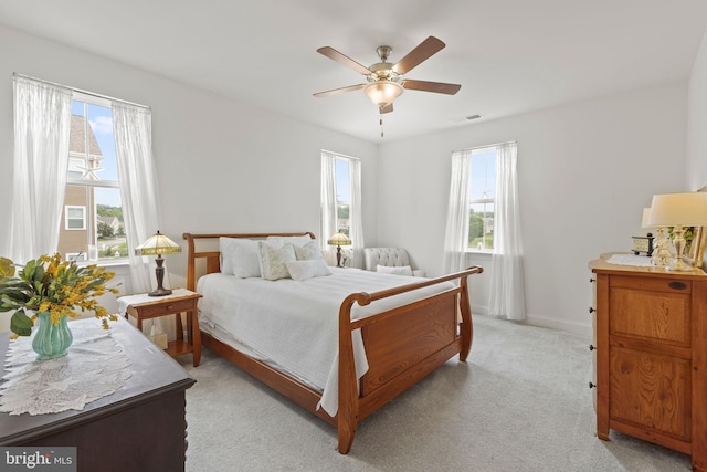 401 Bold Ruler Ct Unit 302, Havre De Grace, MD 21078 - bedroom with multiple windows, light colored carpet, baseboards, and a ceiling fan