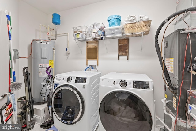 401 Bold Ruler Ct Unit 302, Havre De Grace, MD 21078 - washroom with electric water heater and washing machine and dryer