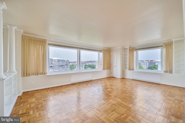 2475 Virginia Ave NW Unit 930, Washington, DC 20037 - unfurnished room featuring decorative columns, radiator, and crown molding