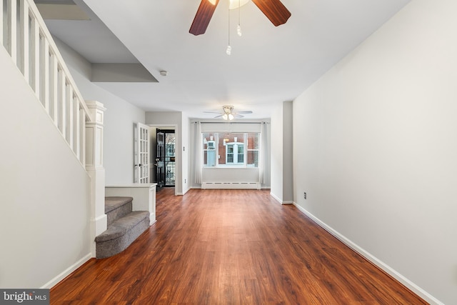 1238 Durfor St, Philadelphia, PA 19148 - unfurnished living room with ceiling fan, stairs, baseboard heating, and wood finished floors