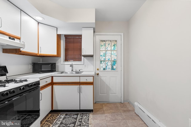 1238 Durfor St, Philadelphia, PA 19148 - kitchen with range with gas cooktop, under cabinet range hood, a sink, white cabinets, and light countertops