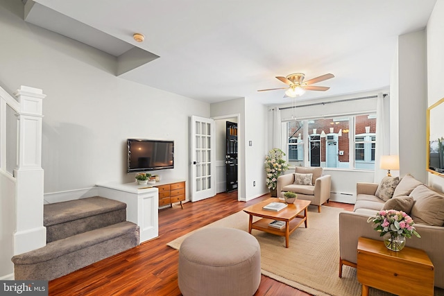 1238 Durfor St, Philadelphia, PA 19148 - living area with a baseboard heating unit, ceiling fan, wood finished floors, and baseboards