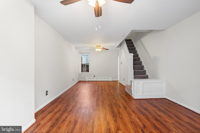 1238 Durfor St, Philadelphia, PA 19148 - unfurnished living room with a baseboard heating unit, a ceiling fan, wood finished floors, and stairway