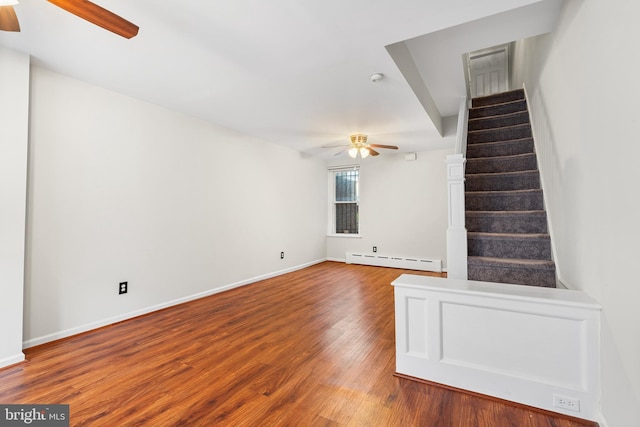 1238 Durfor St, Philadelphia, PA 19148 - unfurnished living room with ceiling fan, baseboard heating, stairway, and wood finished floors