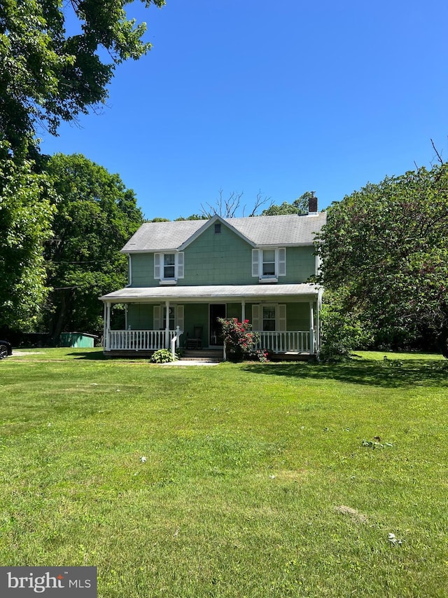 10530 Scaggsville Rd, Laurel, MD 20723 - view of front of house featuring a porch, a chimney, and a front yard