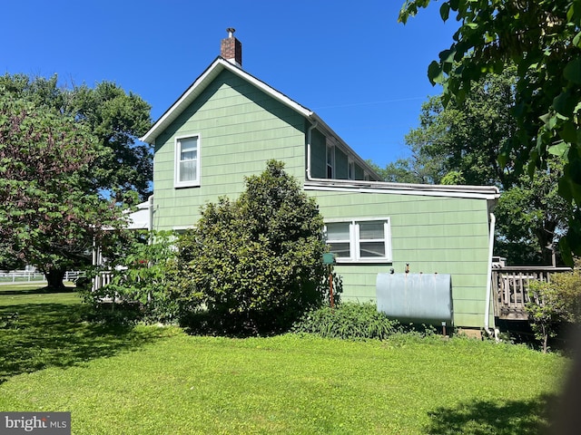 10530 Scaggsville Rd, Laurel, MD 20723 - view of side of property with heating fuel, a yard, and a chimney