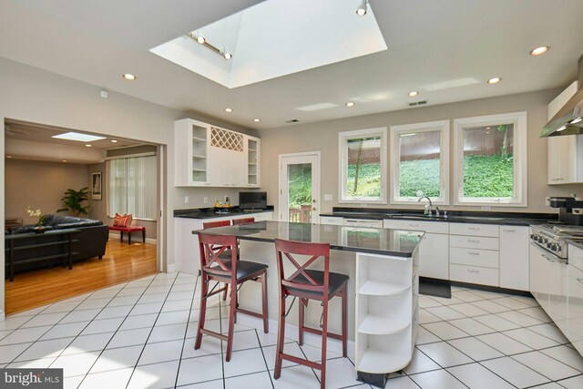 3820 Lorcom Ln, Arlington, VA 22207 - kitchen with open shelves, gas cooktop, dark countertops, white cabinets, and recessed lighting