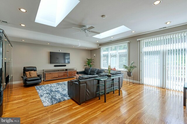 3820 Lorcom Ln, Arlington, VA 22207 - living room with a skylight, light wood-style floors, recessed lighting, baseboards, and ceiling fan