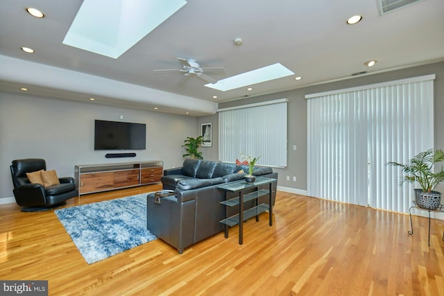 3820 Lorcom Ln, Arlington, VA 22207 - living room with a skylight, light wood-style floors, baseboards, recessed lighting, and a ceiling fan