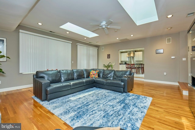 3820 Lorcom Ln, Arlington, VA 22207 - living area with a skylight, ceiling fan, light wood-style flooring, baseboards, and recessed lighting