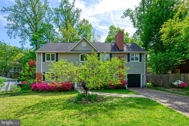 3820 Lorcom Ln, Arlington, VA 22207 - view of front of home featuring asphalt driveway, a garage, and a chimney