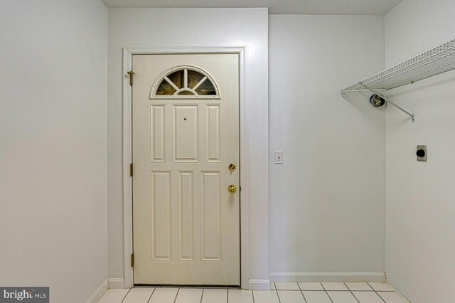 3820 Lorcom Ln, Arlington, VA 22207 - laundry area featuring hookup for an electric dryer, baseboards, and light tile patterned floors