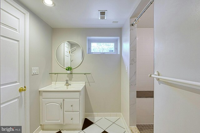 3820 Lorcom Ln, Arlington, VA 22207 - full bathroom with vanity, tiled shower, tile patterned flooring, baseboards, and recessed lighting