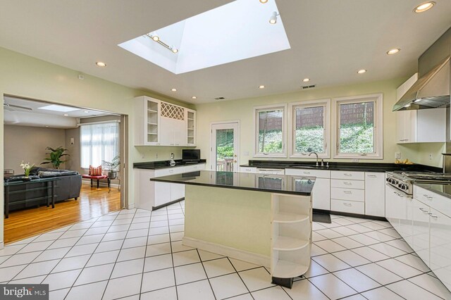 3820 Lorcom Ln, Arlington, VA 22207 - kitchen featuring stainless steel gas stovetop, open shelves, dark countertops, recessed lighting, and white cabinets