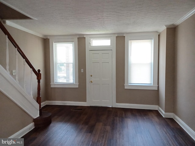 513 N Highland Ave, Baltimore, MD 21205 - entryway featuring dark wood-style flooring, a textured ceiling, healthy amount of natural light, stairway, and baseboards