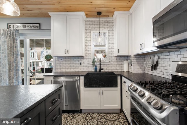 86 Greenfield Ave, Ardmore, PA 19003 - kitchen with appliances with stainless steel finishes, wood ceiling, a sink, white cabinets, and tasteful backsplash