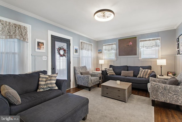 86 Greenfield Ave, Ardmore, PA 19003 - living room featuring crown molding, a decorative wall, wood finished floors, and a wainscoted wall