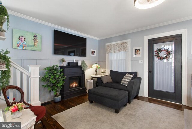 86 Greenfield Ave, Ardmore, PA 19003 - living room featuring crown molding, wood finished floors, a wainscoted wall, a decorative wall, and healthy amount of natural light
