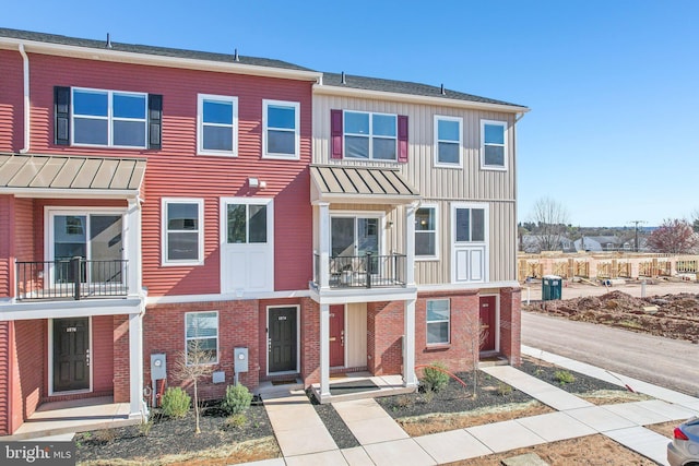 1807 Arch St Unit 21E, Norristown, PA 19401 - townhome / multi-family property with board and batten siding, a balcony, and brick siding