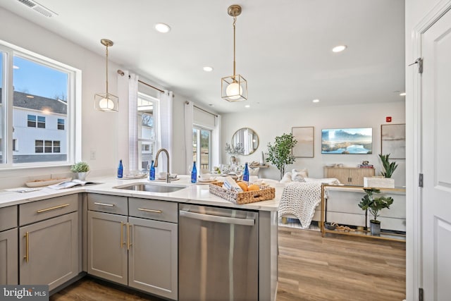 1807 Arch St Unit 21E, Norristown, PA 19401 - kitchen featuring stainless steel dishwasher, gray cabinetry, a sink, wood finished floors, and recessed lighting