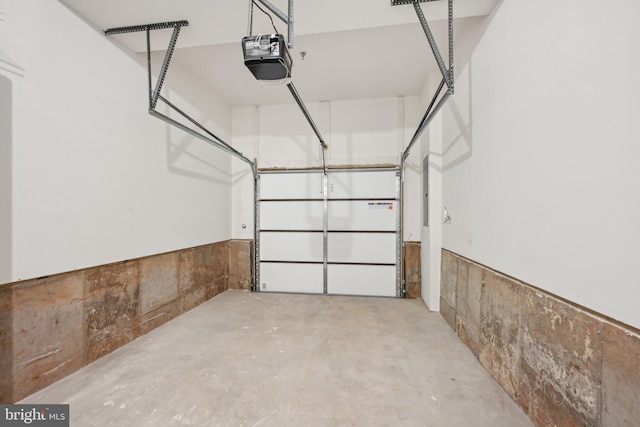 1807 Arch St Unit 21E, Norristown, PA 19401 - garage featuring a garage door opener and wainscoting