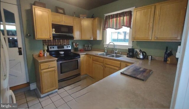 1620 Florence St, Williamsport, PA 17701 - kitchen featuring electric stove, a sink, black microwave, and light countertops